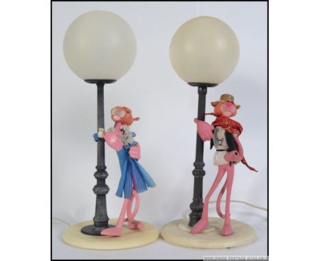 2 vintage 1970's retro Pink Panther table lamps, each with panther character and globe shades. Measures: 53cm.