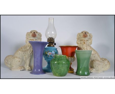 2 Staffordshire ceramic dogs together with a collection of studio pottery, an oil lamp, Victorian urn etc. Measures: dogs 32c