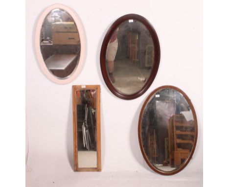 An Edwardian mahogany oval wall mirror together with another similar and also a painted oval mirror ( 3 total  ) Measures: 90