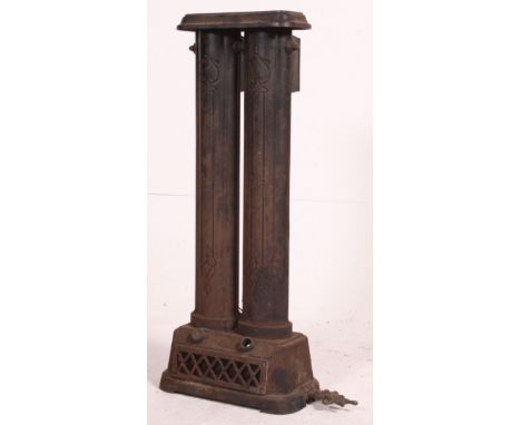 A Victorian cast Iron architectural heater radiator of double form raised on pedestal base. Measures: 100cm x 55cm x 17cm.
