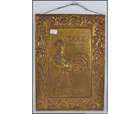 A vintage Take Courage brass advertising sign being cast in relief with notation