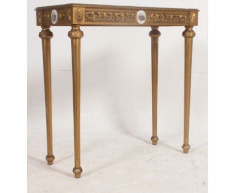 A stunning 19th / 20th century gilt console table, being raised on column legs, with a deep frieze having acanthus carved dec