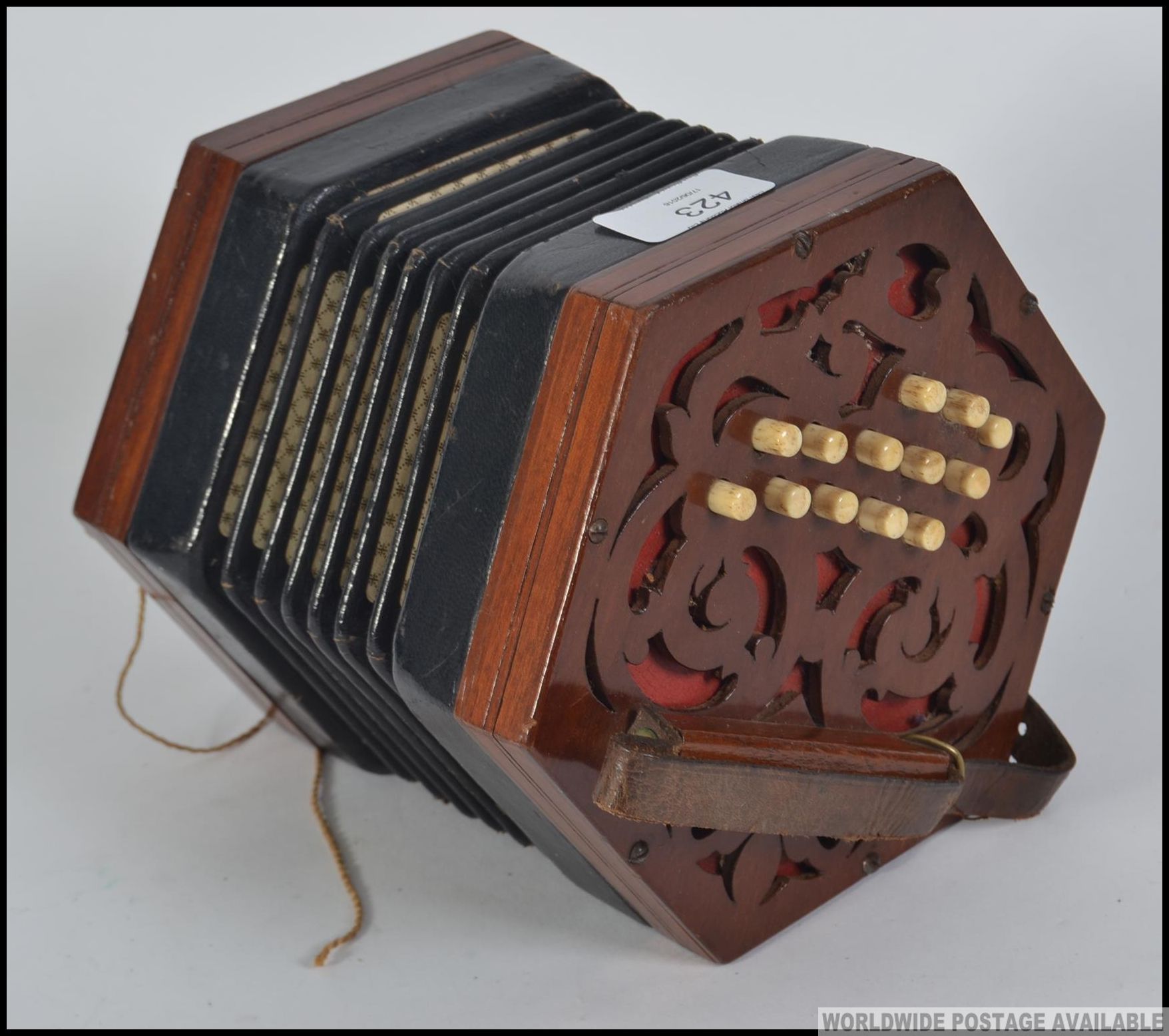 A Victorian mahogany squeeze box musical instrument. The box with