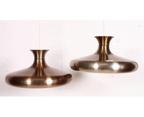 A pair of polished metal retro 20th century conical pendant lamp shades of modernist form. Matching further pair in lot 1153a