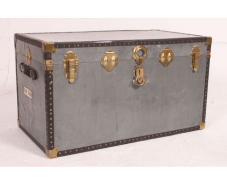 A vintage 20th century grey steamer trunk with brass effect clasps, hinged top with lined interior. Measures: 52cm x 92cm x 5