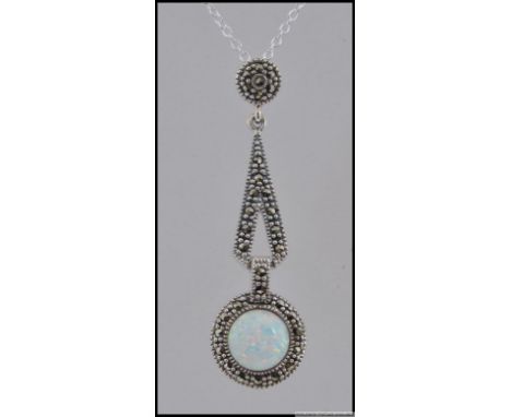 A silver marcasite and opal pendant necklace on a silver chain