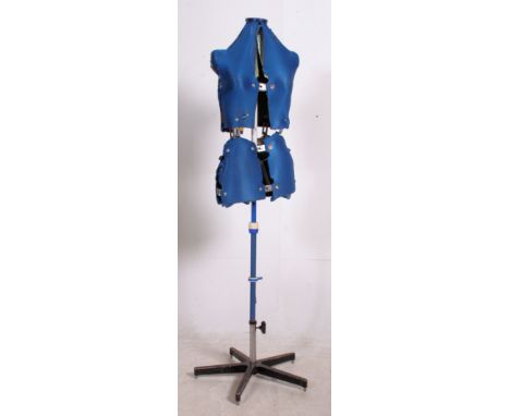 A 20th century large tailors / shop haberdashery mannequin raised on stand, the blue sectional torso on stand. Measures: 165c