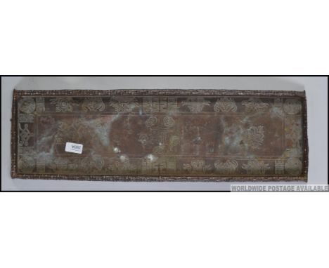 An early 20th century rectangular Chinese / Asiatic copper tray of  with detailing to the inner borders with central characte