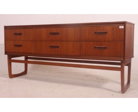 A vintage teak Danish style 6 drawer sideboard dresser raised on shaped arch supports, the six drawers with recess handles to