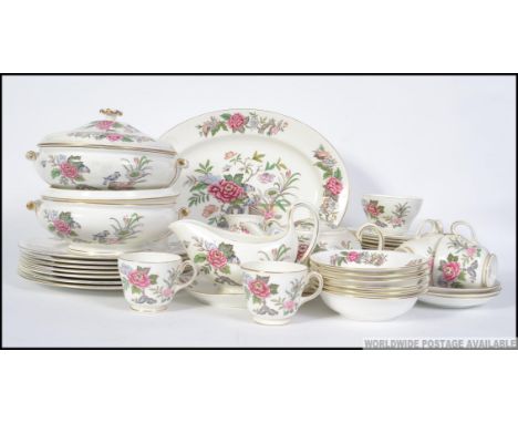 A Wedgwood Cathay pattern part dinner / tea service comprising cups, saucers, plates, tureens etc. All stamped to the base