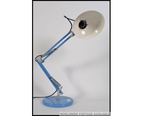 A retro anglepoise desk lamp in the manner of Herbert Terry with blue painted pendant shade and adjustable anglepoise arms on