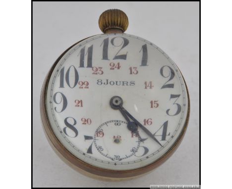A vintage 8 Jours Fish Eye clock having thick glass with brass surround and loop. Measures: 7cm H.