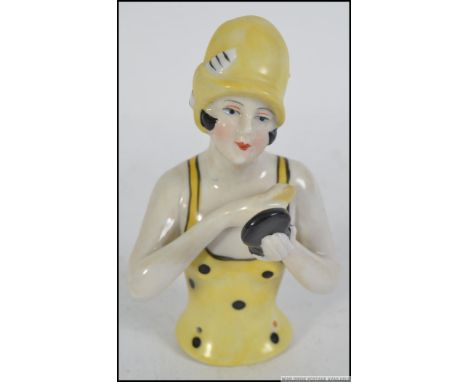 A 20th century ceramic art deco style pin dolly figure of an art deco lady