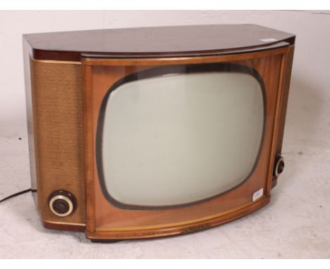 A vintage mid century GEC television with bow glass facia and walnut case. Measures: 40cm x 60cm.
