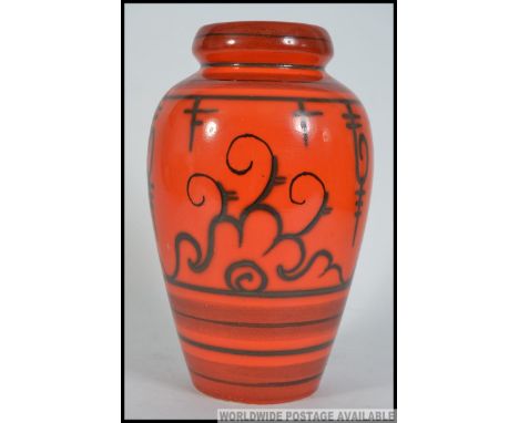 A 1970's retro orange ceramic Tokio Gouda Flora dutch vase bearing stamps to the base. Measures: 19cm H 