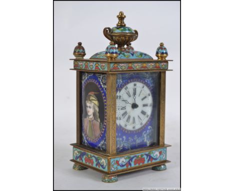 A 19th century French enamel champleve brass and gilded metal carriage clock. The clock case with decoration of foliate scrol