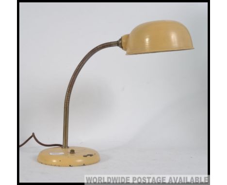 A vintage mid century anglepoise / gooseneck desk lamp, with an oversized pendant shade and adjustable gooseneck on circular 