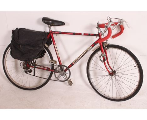 A vintage / retro 20th century Puch Pacemaker road bike, a small frame with five sped gears. The frame measures form the base