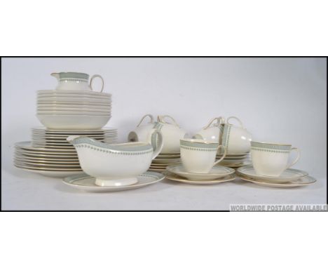 A Royal Doulton dinner and tea service in the Berkshire pattern, having covers for eight people consisting of trio's, dinner 