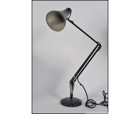 A 20th century Herbert Terry Anglepoise lamp, raised on a circular base with pendant shade finished in original black paint. 