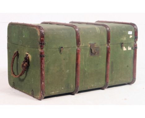 A 19th century green and canvas bound steamer trunk with hinged centre - ideal as conversion to a coffee table. Measures: 47c
