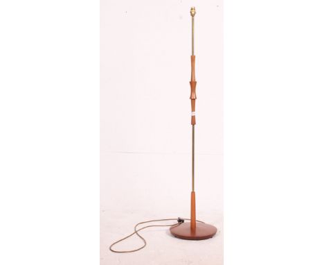 Retro vintage 1970's teak standard lamp with circular base and brass fittings. Measures: 137cm H.