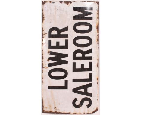 A vintage 20th century enamel advertising sign ' Lower Saleroom ' in white with black writing.  Measures: 92cm x 46cm.