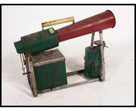 A vintage mid 20th century Zone Industrial Bird Scarer No 2 having angular horn and shaped base in the original two tone gree