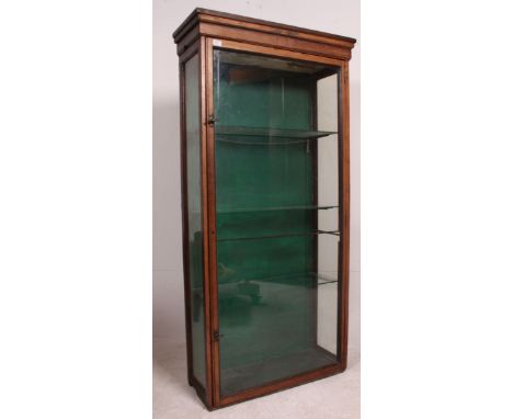 A Victorian large mahogany and glass shop display cabinet. The upright body with glazed panels having full length door with b