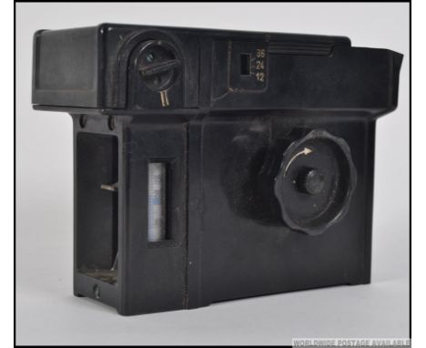 A vintage Agfa rondinax 35u daylight developing tank having dial to side with notation to top. Made in Germany. Measures: 13c