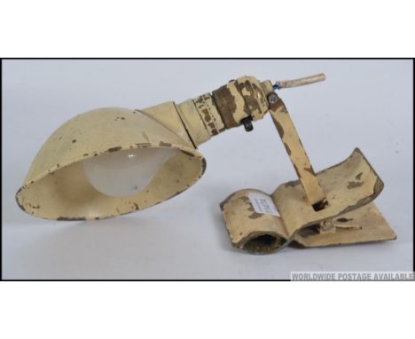 A stunning retro / vintage industrial mid century machinist lamp, having an adjustable clamp to the base and a adjustable dir