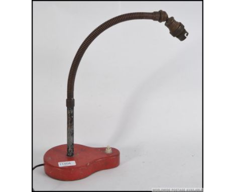 A vintage mid century goose neck anglepoise desk lamp raised on unusual shaped metal plinth base. Measures: 46cm H.