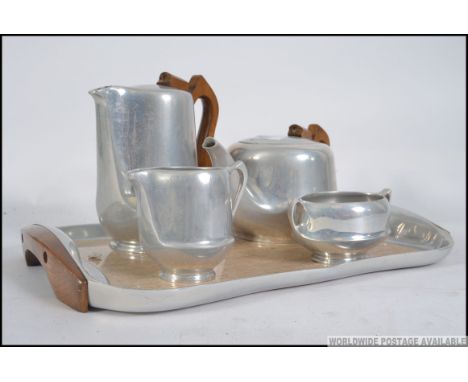 A vintage retro Picquot ware coffee service, consisting of coffee pot, tea pot, creamer, sugar bowl and tray. Measures: 43cm 