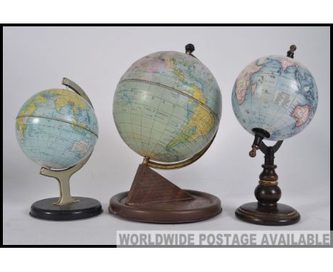 A collection of vintage 20th century desk top globes, all on plinth bases. 2 being Chad Valley. Measures H30cm
