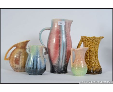 A collection of art deco and later ceramic jugs by Sylvac, five jugs in total please see images