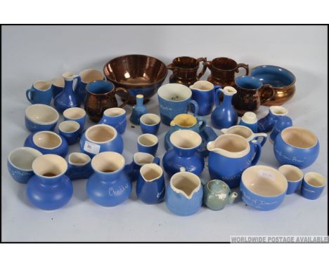 A collection of Devonmoor mottoware together with a collection of ceramic lustre wares all dating from the early to mid 20th 