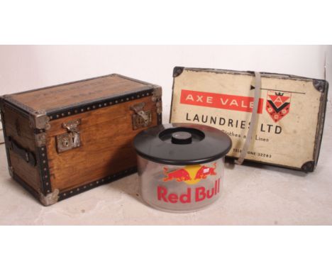 A vintage laundry basket with original notation for Axe Vale Launderies together with a wooden chest marked for Paddington be