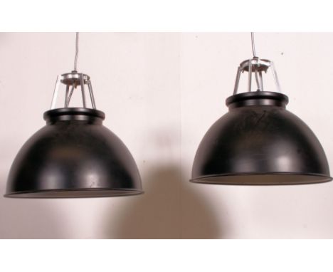 A good large pair of contemporary industrial style pendant ceiling light fixtures having ebonised finish with polished metal 