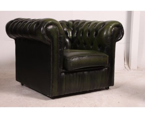 A good quality green leather  deep buttoned Chesterfield club armchair having barrel arms with green leather buttoning. Match