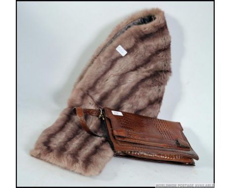 A vintage Crocodile skin ladies 1950's handbag together with a vintage mid century ladies fur stole having lined back. Measur