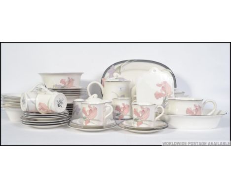 A Noritake ' Cafe De Soir ' dinner and tea service comprising 6 dinner plates, 6 side plates, soup bowls, teapot, cups, sauce