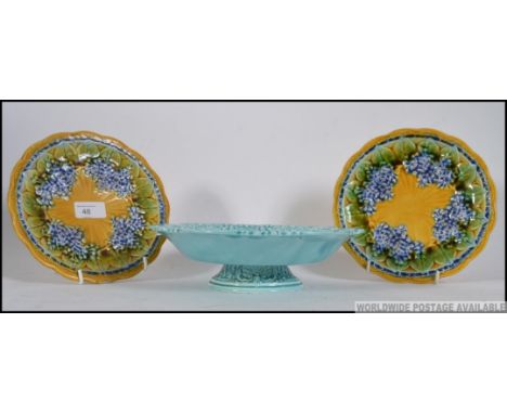2 Majolica ceramic glazed plates together with a blue glazed tazza by Villeroy & Boch, marked to base. Measures: 20cm diamete