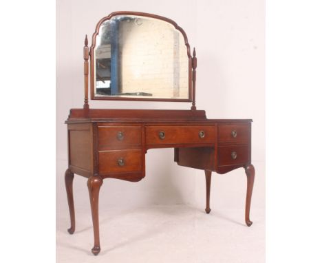 A good quality Edwardian solid mahogany Queen Anne revival dressing table.  Raised on cabriole legs with fitted kneehole draw