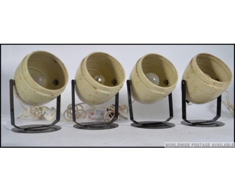A set of 4 industrial KODAK 1960's beehive dark room lamps in cream with ball finial bodies on black metal stands . Measures: