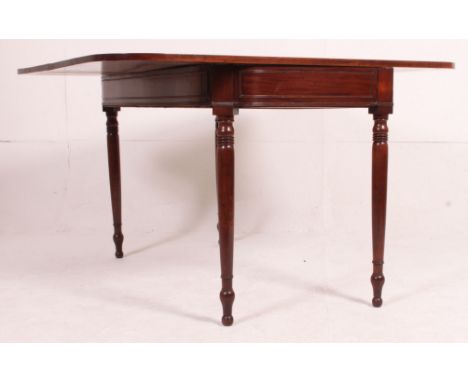 A Georgian 19th century mahogany tea table / games table having flip over table top supported with gate leg action. Measures: