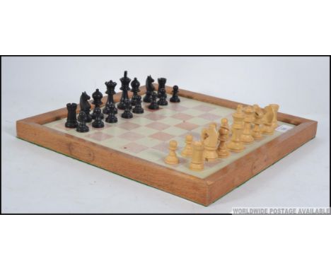A vintage boxed wooden chess set by L&K of London together with a marble / stone chess board