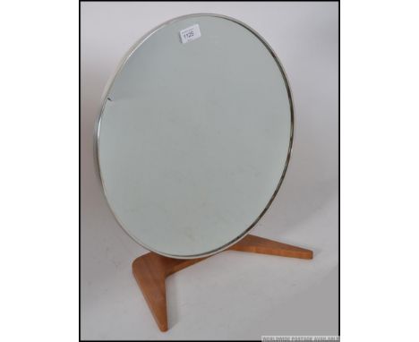 A retro 1970's teak wood dressing table / vanity circular mirror raised on a single pedestal stand supported by a circular ba