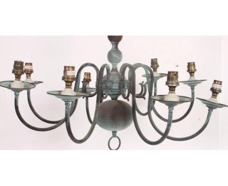 A 20th century vintage brass chandelier having multiple arms with central ball finials, sconces to each arm end. Measures: 47