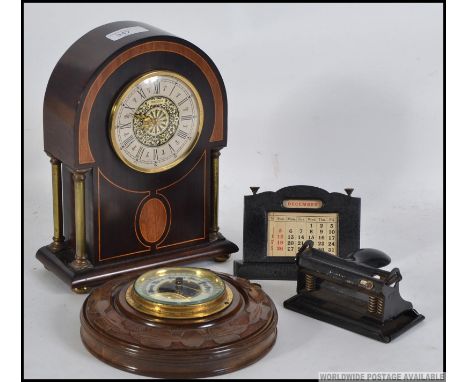 A mixed lot to include a vintage desk calendar , vintage hole punch , a barometer and a mantle clock. Measures: 24cm H