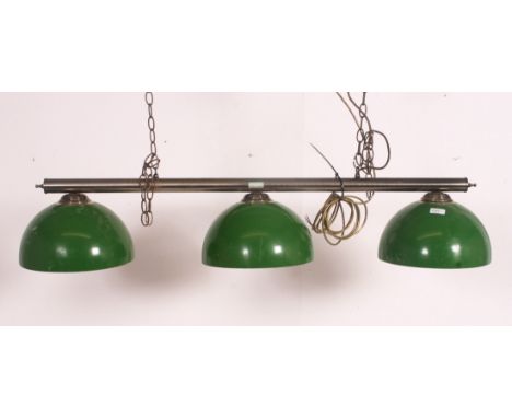 A modern brass ceiling mounted, hanging snooker table down light. Three lights and 3 baize green glass shades of conical form
